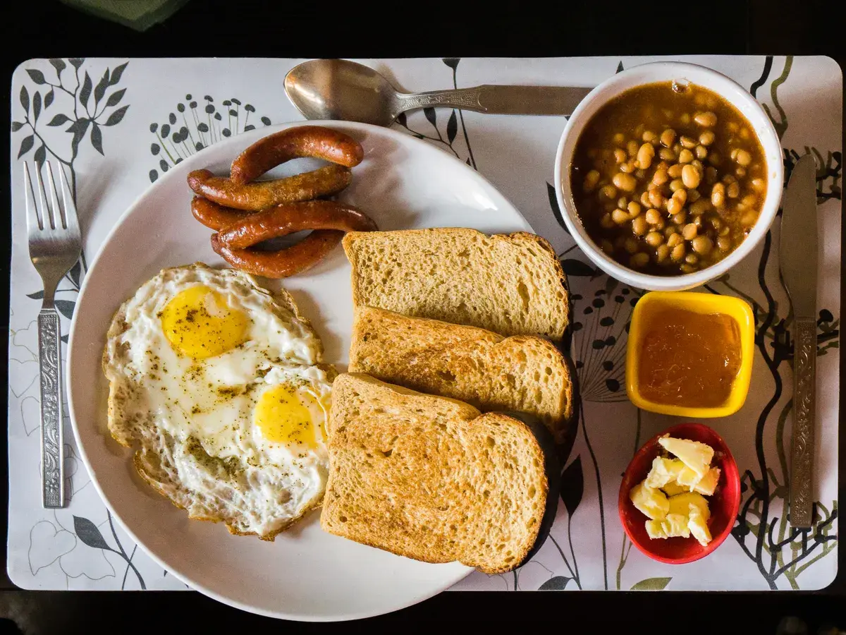 Breakfast plate with eggs, sausages and toast
