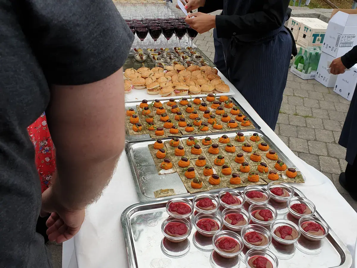 Catering table with trays of bites
