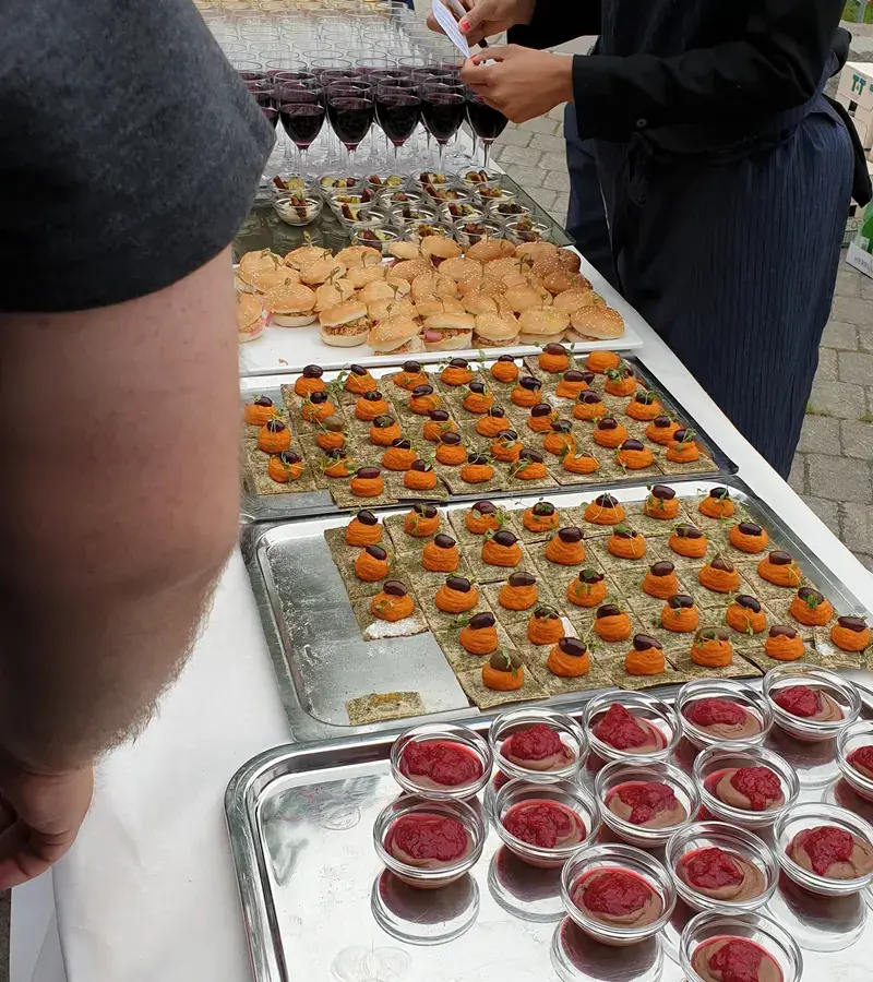 Catering table with trays of bites